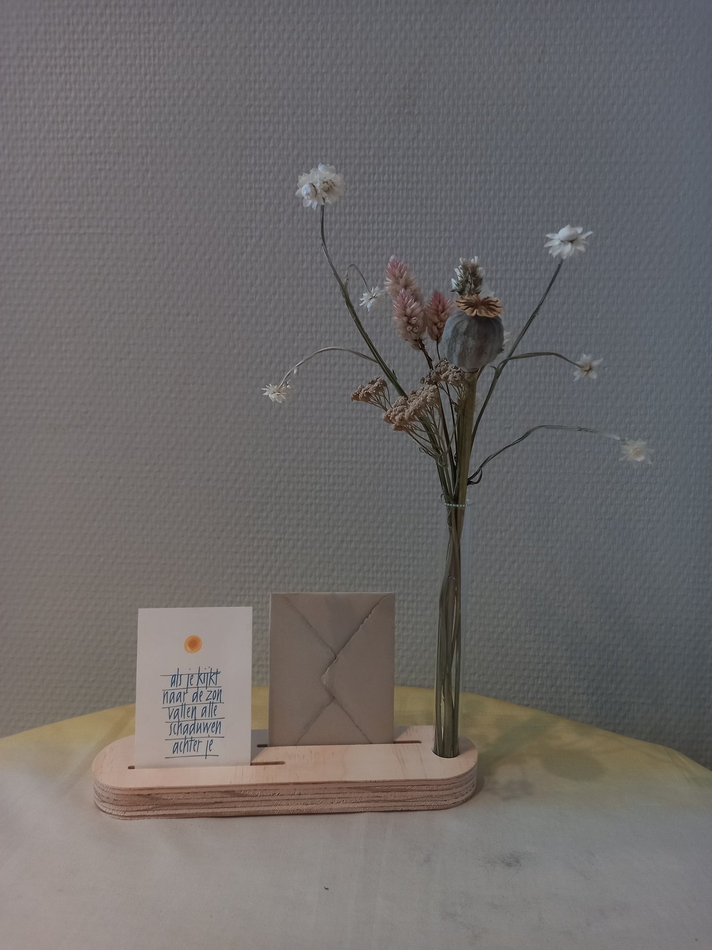 Quotehouder met bloemenvaasje